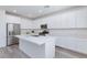 Gourmet kitchen featuring stainless appliances, quartz countertops, and white cabinets at 835 Aurelie Ridge St, Henderson, NV 89011