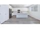 Gourmet kitchen features stainless appliances, an island, and white cabinets at 835 Aurelie Ridge St, Henderson, NV 89011