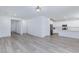 Spacious living room showcasing modern light fixture and an open floorplan to kitchen at 835 Aurelie Ridge St, Henderson, NV 89011