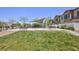 Playground with picnic benches and a grassy area in a residential community at 835 Aurelie Ridge St, Henderson, NV 89011