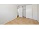 This airy bedroom has a tile floor, an open closet and entry door to a hallway at 882 Westminster Ave, Las Vegas, NV 89119