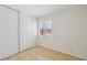 Bedroom featuring tile floors, a large window, and a sliding door closet at 882 Westminster Ave, Las Vegas, NV 89119