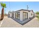 Home with a large slider window with a desert landscaped backyard, offering a private oasis at 882 Westminster Ave, Las Vegas, NV 89119