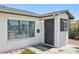 Charming front entrance with security door and large window providing ample natural light at 882 Westminster Ave, Las Vegas, NV 89119