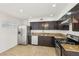 A kitchen featuring stainless steel appliances, granite countertops, and tile flooring at 882 Westminster Ave, Las Vegas, NV 89119