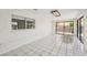 Spacious sun room with tile floors, large window, and sliding glass door at 882 Westminster Ave, Las Vegas, NV 89119