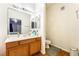 Well-lit bathroom featuring wood cabinets and a large mirror, providing functionality and style at 9330 W Maule Ave # 138, Las Vegas, NV 89148