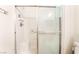 The bathroom showcases a shower featuring a glass sliding door and shower head at 9330 W Maule Ave # 138, Las Vegas, NV 89148