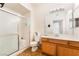 Well-lit bathroom featuring a vanity with drawers and shower with sliding doors at 9330 W Maule Ave # 138, Las Vegas, NV 89148