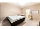 Inviting bedroom space with neutral walls and carpet, and furniture for an infant at 9330 W Maule Ave # 138, Las Vegas, NV 89148