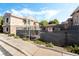 Apartment complex exterior highlighting accessible entrances, landscaping, and secure fencing at 9330 W Maule Ave # 138, Las Vegas, NV 89148
