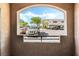View of parking lot with parked cars and a glimpse of apartment buildings in the background at 9330 W Maule Ave # 138, Las Vegas, NV 89148