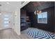 Chic bar area boasts custom shelves, a geometric rug, and a unique ceiling design at 9617 Sard Ln, Las Vegas, NV 89143