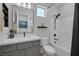 Modern bathroom boasts sleek vanity, mirror, and a shower with stylish black fixtures at 9617 Sard Ln, Las Vegas, NV 89143