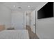 Contemporary bedroom featuring a closet, sleek floors, and a wall-mounted television at 9617 Sard Ln, Las Vegas, NV 89143
