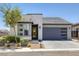 Charming single-story home featuring a modern design, neutral tones, and a well-manicured front yard at 9617 Sard Ln, Las Vegas, NV 89143