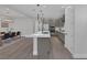 Open concept kitchen with an island, stainless steel appliances, and an adjacent dining area at 9617 Sard Ln, Las Vegas, NV 89143