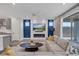 Bright living room with electric fireplace and large sliding glass doors at 9617 Sard Ln, Las Vegas, NV 89143