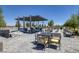 Outdoor seating area with chess, a fireplace, and shaded seating creating a relaxing ambiance at 9617 Sard Ln, Las Vegas, NV 89143