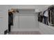 Organized walk-in closet with shelving and hanging rods for ample storage in a modern design at 9617 Sard Ln, Las Vegas, NV 89143