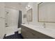 Elegant bathroom with double sinks, modern fixtures, and stylish tile accents in the shower at 9789 Twilight Moon Ave, Las Vegas, NV 89148