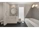 Modern bathroom features custom mirror and tile work, stand-alone garden tub at 9789 Twilight Moon Ave, Las Vegas, NV 89148