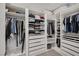Spacious walk-in closet with custom shelving and drawers for organized storage and clothing display at 9789 Twilight Moon Ave, Las Vegas, NV 89148
