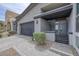 Modern home with a flat roof, two-car garage, and stone driveway at 9789 Twilight Moon Ave, Las Vegas, NV 89148