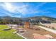 Community playground area with modern equipment, seating, and a scenic mountain backdrop at 9789 Twilight Moon Ave, Las Vegas, NV 89148