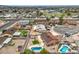 The aerial view displays a home with a backyard pool, landscaping, and proximity to suburban streets at 1004 Woodside Ct, Henderson, NV 89015