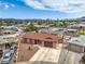 An aerial perspective showcasing a well-situated home with a spacious driveway and nearby neighborhood amenities at 1004 Woodside Ct, Henderson, NV 89015