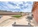 A charming backyard featuring a shed, lawn, patio and inviting seating areas for outdoor relaxation at 1004 Woodside Ct, Henderson, NV 89015