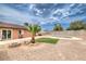 Outdoor space offering a pool, a well-kept lawn, a small tree, and patio furniture for outdoor relaxation at 1004 Woodside Ct, Henderson, NV 89015