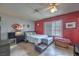 Bedroom with view of furniture and natural light from exterior window at 1004 Woodside Ct, Henderson, NV 89015