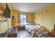 Cozy bedroom features a window letting in natural light and a comfortable bed with floral accents at 1004 Woodside Ct, Henderson, NV 89015
