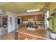 View of kitchen with wooden cabinets, stainless steel appliances, and a center island at 1004 Woodside Ct, Henderson, NV 89015