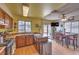 Eat-in kitchen area featuring wood cabinets, stainless steel appliances, and a dining table at 1004 Woodside Ct, Henderson, NV 89015