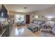 Well-decorated living room with wood floors, neutral colors, and ample seating at 1004 Woodside Ct, Henderson, NV 89015