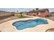 Inviting backyard pool with tanning deck, perfect for relaxation and outdoor entertainment at 1004 Woodside Ct, Henderson, NV 89015