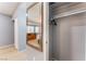 Bedroom closet with a view of dresser, mirror, and window with blinds, providing ample storage space at 1012 Greystone Dr, Las Vegas, NV 89108
