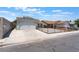 Inviting single-story home showcases a two-car garage and a secure fenced yard enhancing curb appeal at 1012 Greystone Dr, Las Vegas, NV 89108
