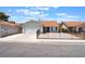 Charming single-story home featuring a two-car garage and low-maintenance landscaping in a secure fenced yard at 1012 Greystone Dr, Las Vegas, NV 89108