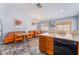 Eat-in kitchen with tiled floor, wooden cabinets, and breakfast nook at 1012 Greystone Dr, Las Vegas, NV 89108