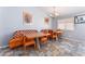 Eat-in kitchen featuring two tables with orange chairs and built in seating at 1012 Greystone Dr, Las Vegas, NV 89108