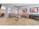 Light and bright living room with plank flooring, comfortable sofas, and a pool table for entertaining at 1012 Greystone Dr, Las Vegas, NV 89108