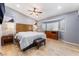 Main bedroom with wood floors, ceiling fan, bay window, and stylish furniture at 1012 Greystone Dr, Las Vegas, NV 89108