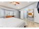 Main bedroom with bay window, wood floors, ceiling fan, and closet at 1012 Greystone Dr, Las Vegas, NV 89108