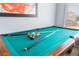 Pool table featuring all the billiard equipment and a window at 1012 Greystone Dr, Las Vegas, NV 89108