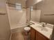 This bathroom features a vanity with storage, tiled flooring and a shower over tub combination at 10231 Deerfield Beach Ave # 104, Las Vegas, NV 89129