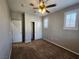 This bedroom features carpeted floors, a ceiling fan and a closet for ample storage at 10231 Deerfield Beach Ave # 104, Las Vegas, NV 89129